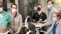 Members of the ICU care team hold a meeting